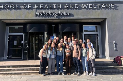 A group of students outside a school in Sweden.